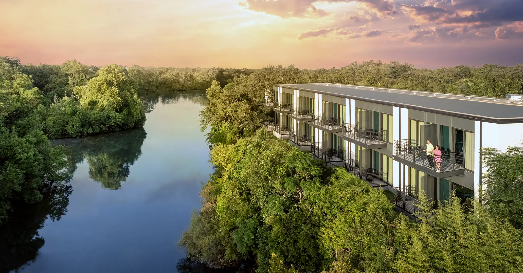 An aerial photograph of The Ruby Hotel & Bar in Round Rock, Texas at sunrise along Brushy Creek. Photo credit: Go Round Rock