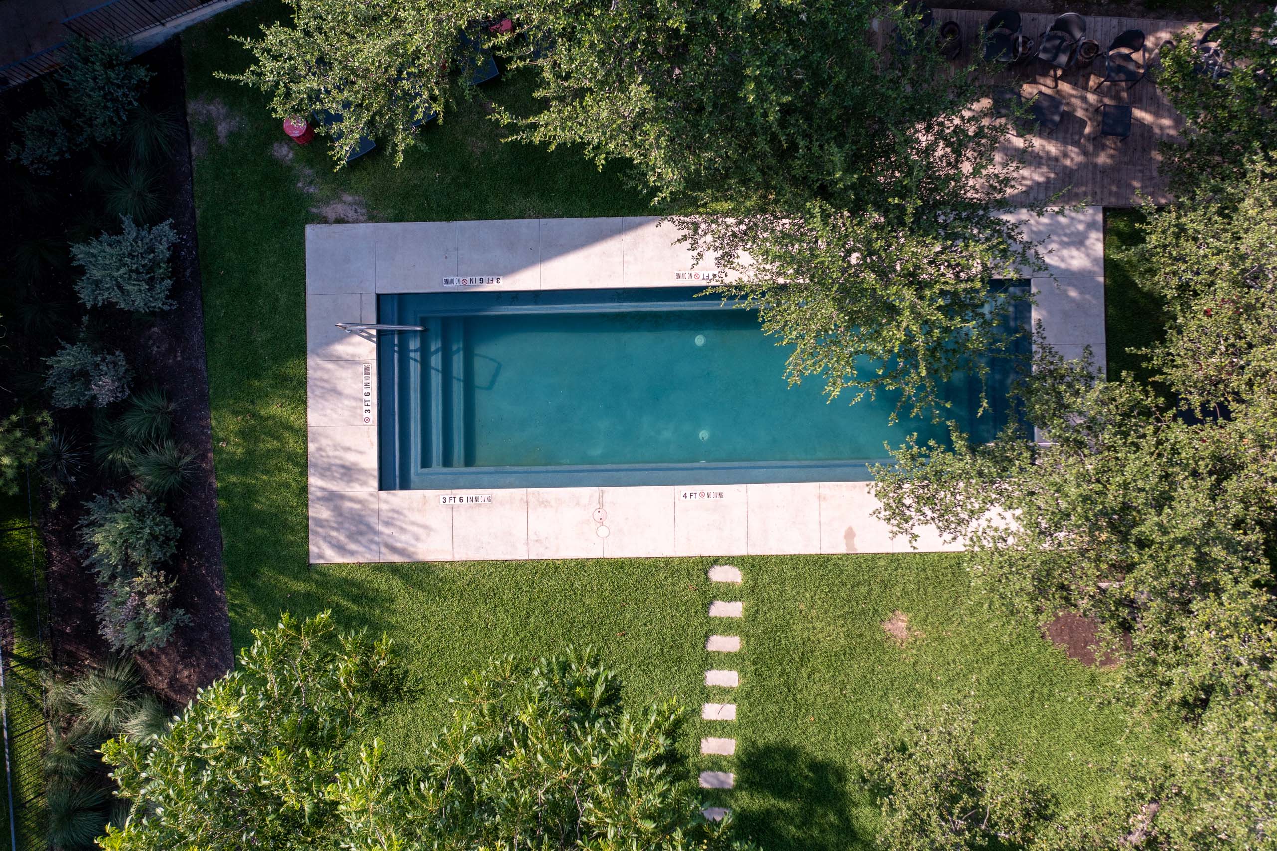 An aerial photograph of the outdoor pool at The Ruby Hotel & Bar in Round Rock, Texas.